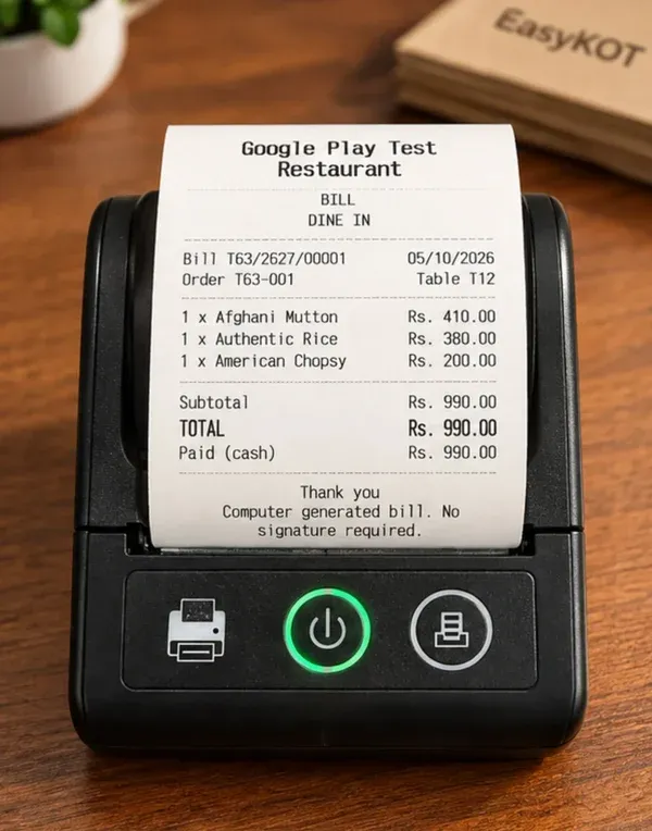 SEZNIK 58mm printer se nikalta bill: Google Play Test Restaurant, BILL, DINE IN, Bill T63/2627/00001, 05/10/2026, Table T12, teen dishes, TOTAL Rs.990.00, Paid (cash)