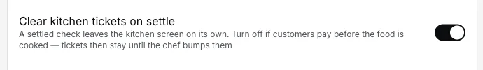 EasyKOT register settings: the 'Clear kitchen tickets on settle' toggle switched on, explaining that a settled check leaves the kitchen screen on its own and that tickets stay until the chef bumps them if customers pay before the food is cooked